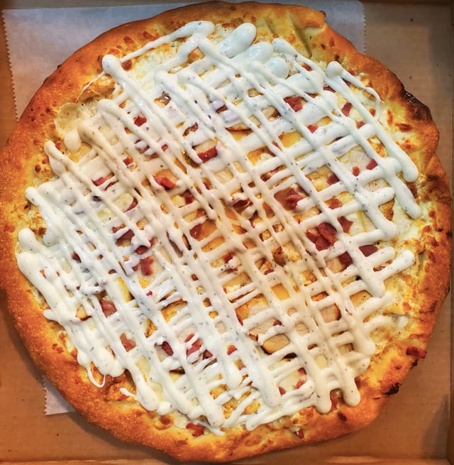 The Vegan Buffalo Chicken Pizza Club.